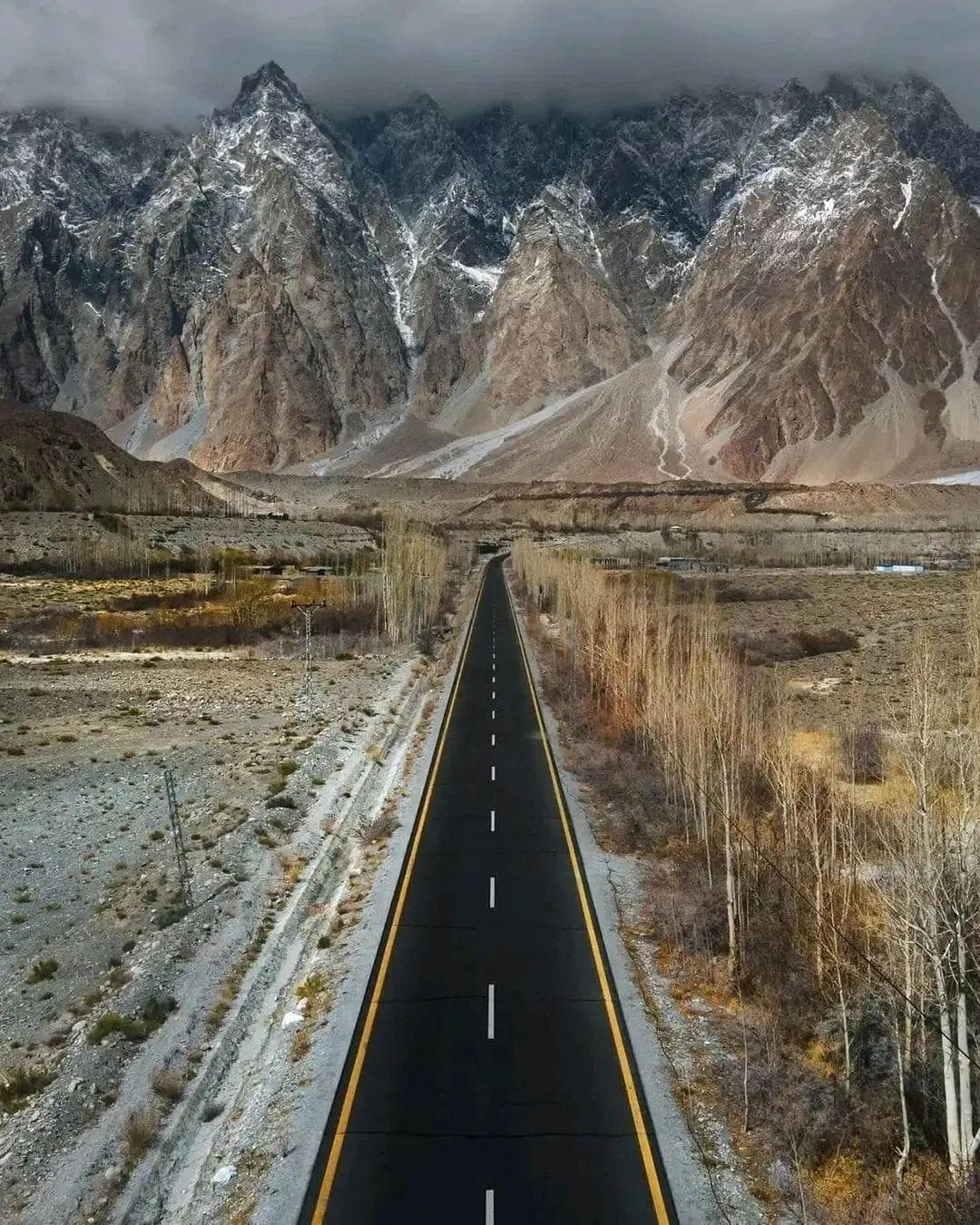 The Karakoram Highway winding past Passu Cones in Hunza, Northern Pakistan